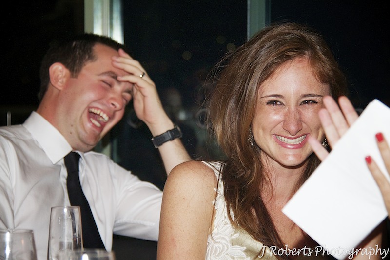 Bride laughing at wedding speeches - wedding photography sydney